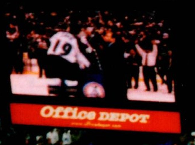 Video screen showing captain Joe Sakic, No. 19, receiving the Stanley Cup