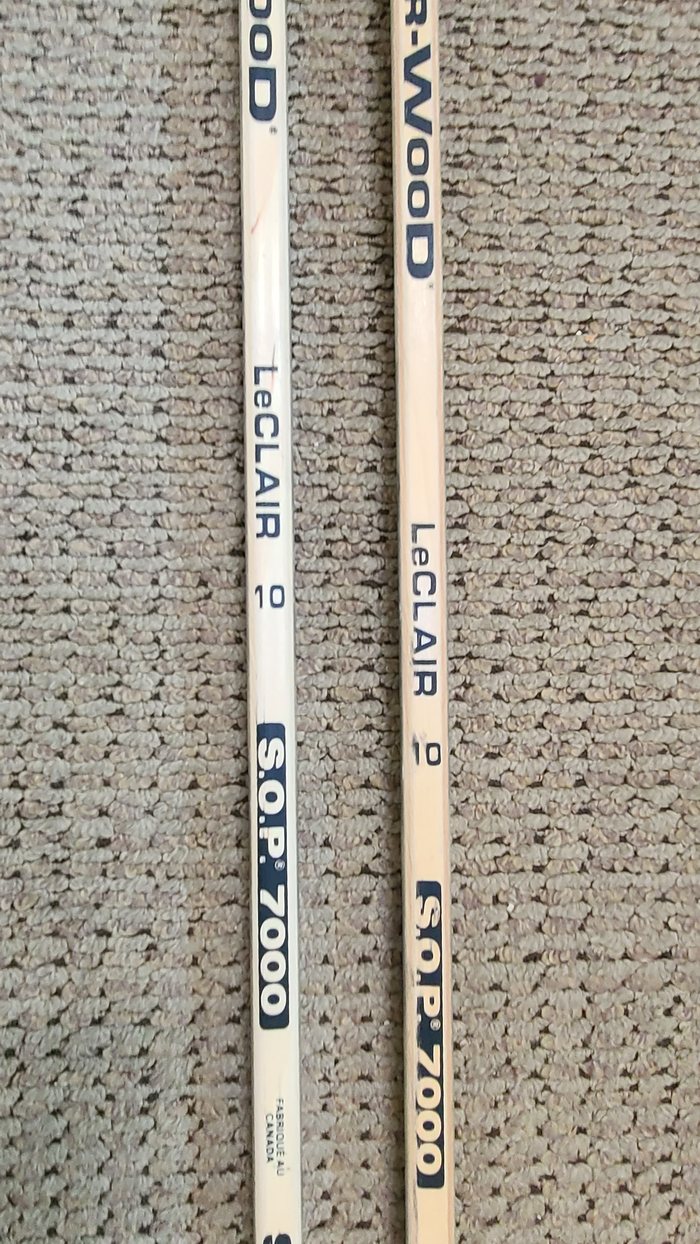 LeClair name and number 10 printed on the stick shafts